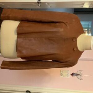 Brown leather jacket  with two button closure at neck